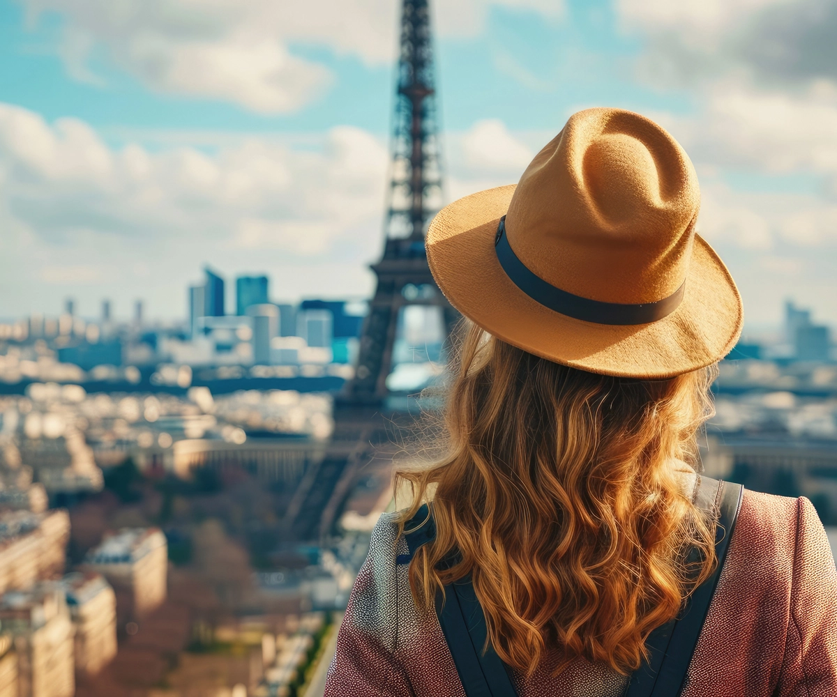 A woman wearing a hat exploring France